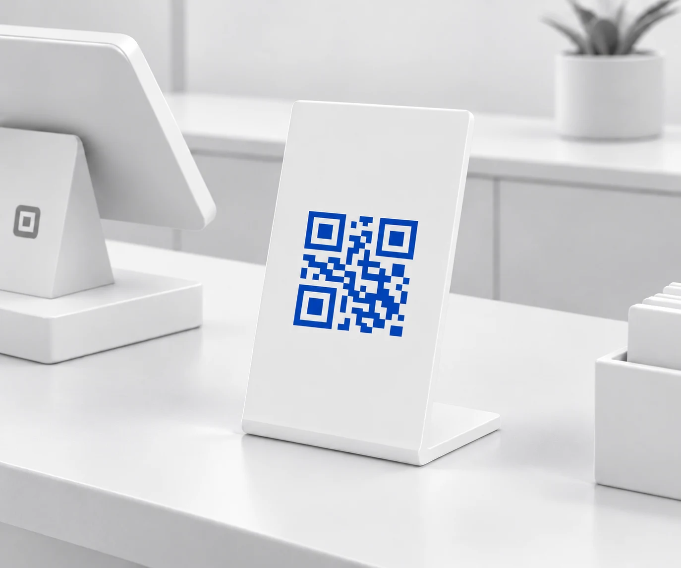 A LOYAI enrollment code on a stand beside the card reader
